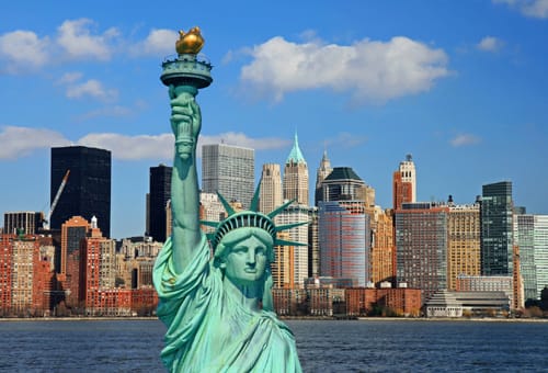The Statue of Liberty and Manhattan Skyline - New York